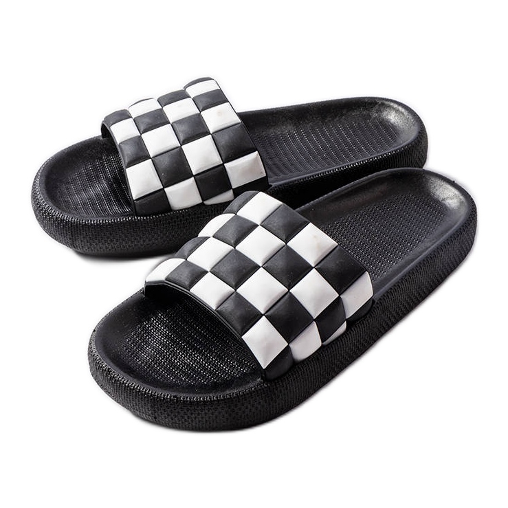 Mustat kumitasoiset tossut Eliniltä