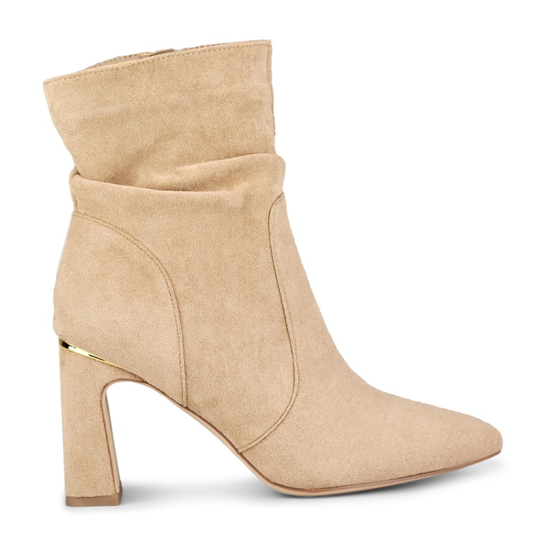 Naisten beigenväriset saappaat koristeellisessa tolppassa