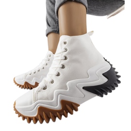 Toron valkoiset urheilulenkkarit paksulla pohjalla valkoinen