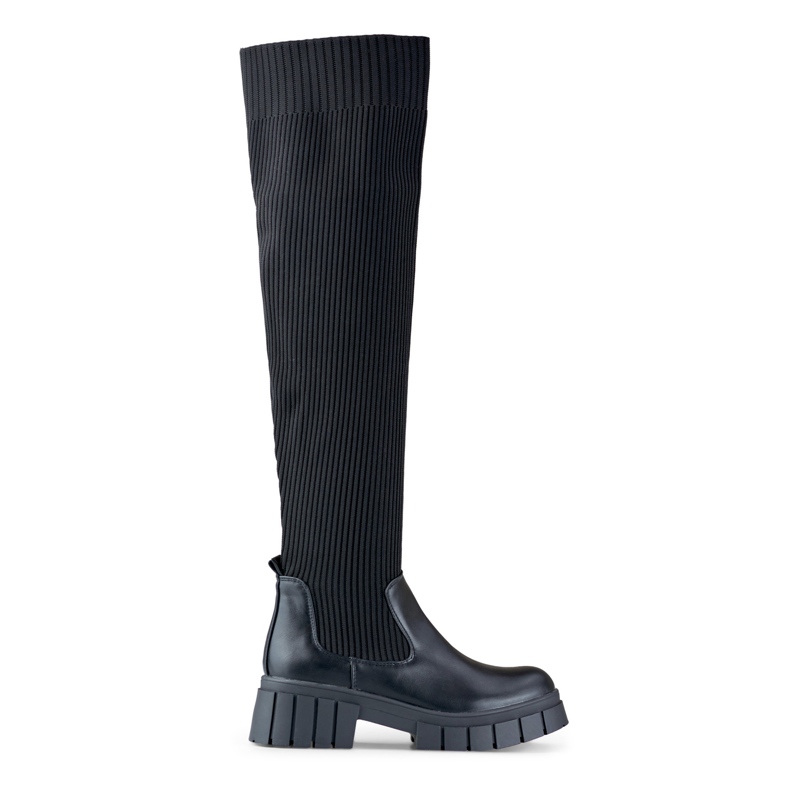 Mustat polven yli ulottuvat saappaat, joissa joustava päällinen