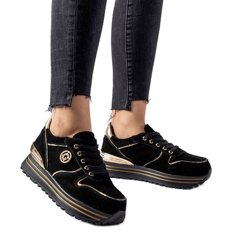 Mustat ja kultaiset Therrien mokkanahkaiset tennarit