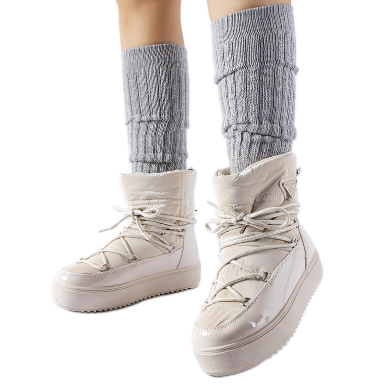 Calogero beigenväriset patentoidut lumisaappaat kuminauhalla