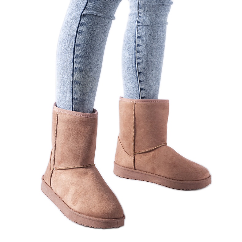 Vaaleanpunaiset eristetyt klassiset Liberon lumisaappaat vaaleanpunainen