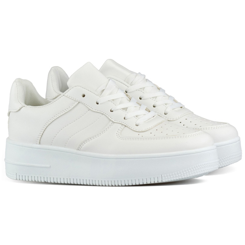 Valkoiset naisten urheilukengät paksulla pohjalla valkoinen