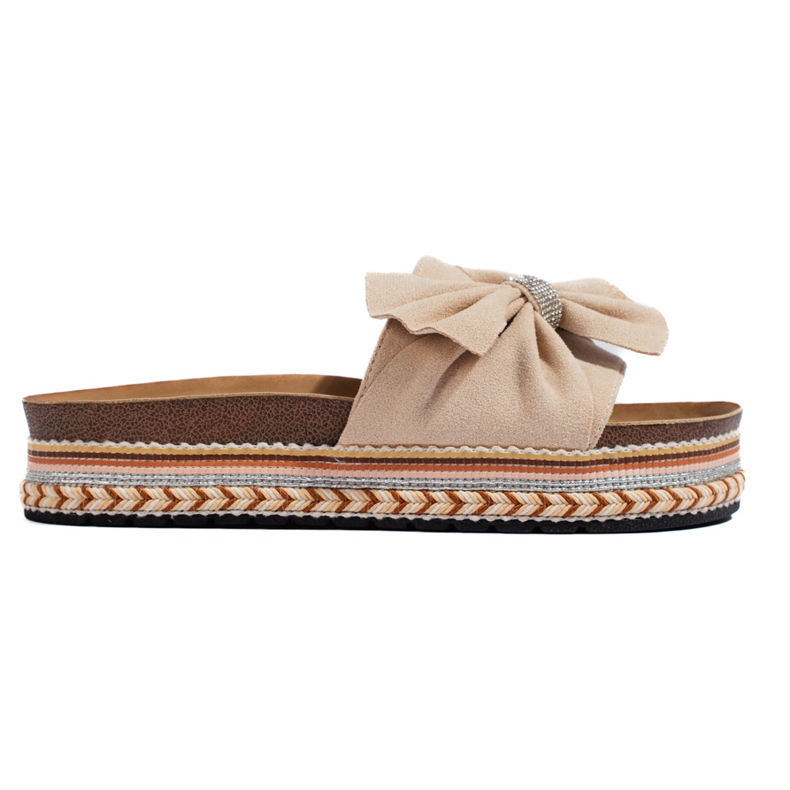 Beige mokkanahkainen liukumäki rusetilla