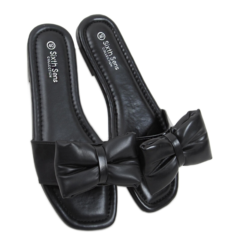 Mili Mustat tossut rusetilla