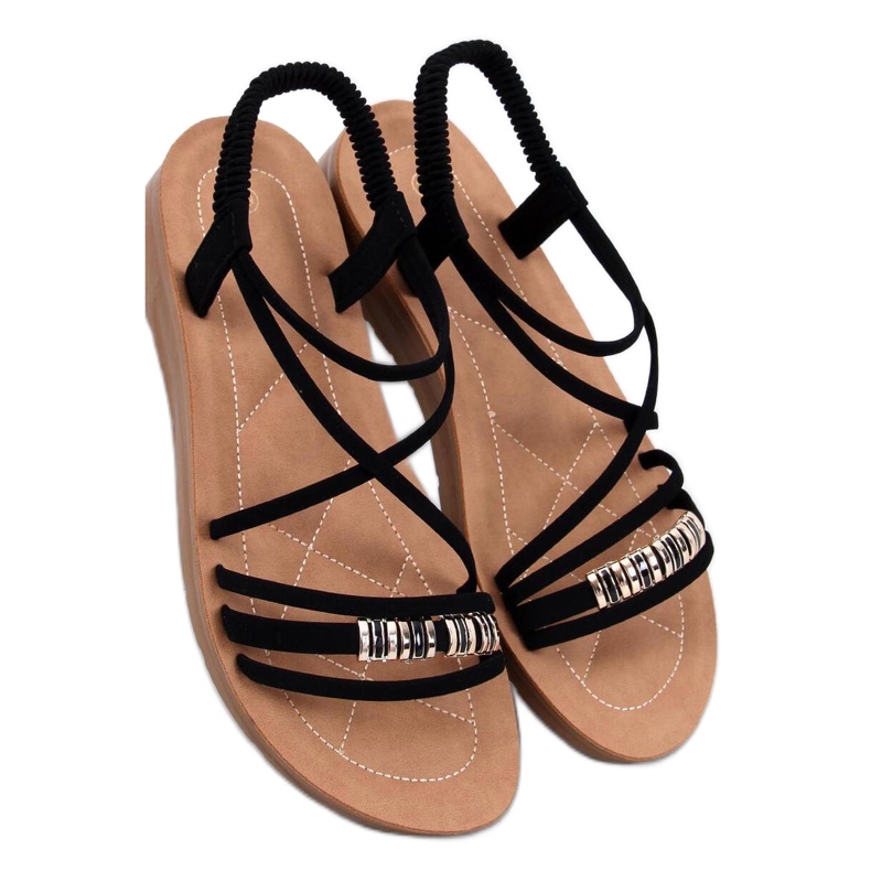 Minimalistiset sandaalit herkällä mustalla alustalla