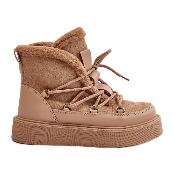 Tummanbeiget Tamidran lumisaappaat alustalla