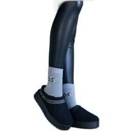 Mustat alustalumisaappaat, joissa matala päällinen ja kirjailtu Greene-kuvio