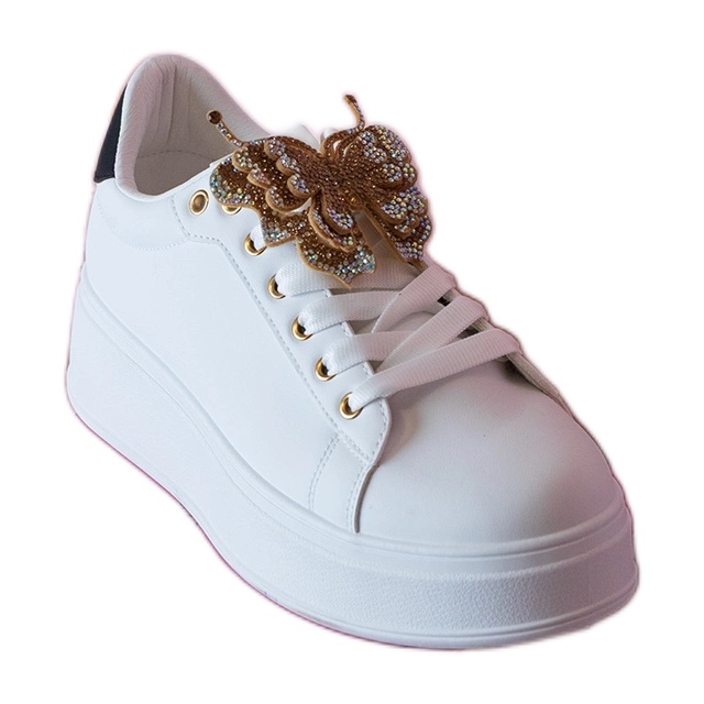 Mustavalkoiset lenkkarit, jotka on koristeltu perhonen kanssa zirkonilla valkoinen