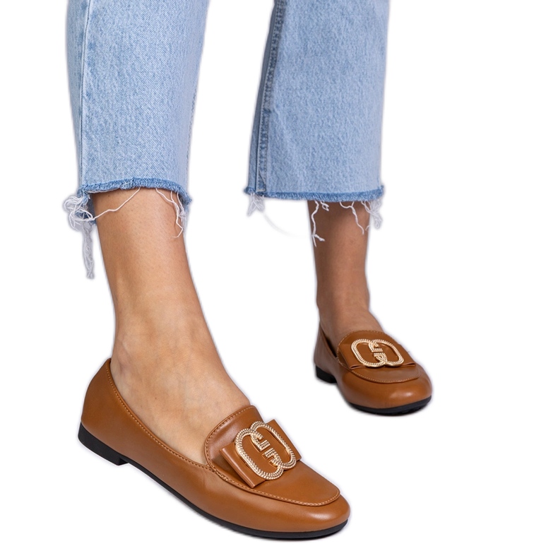 Ruskeat naisten leipät, joissa on kultainen sisustus