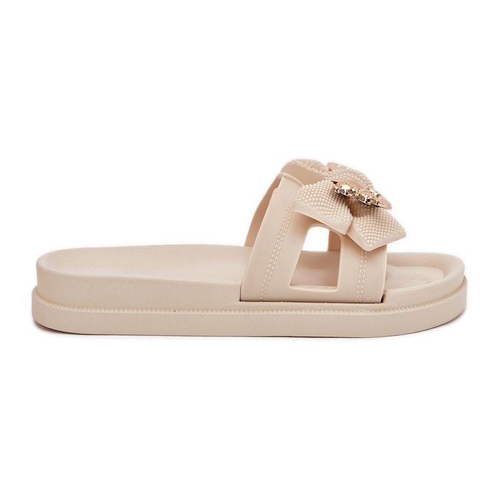 Naisten flip flops, jossa on keula ja kultainen kirkas keitetty rintakoru beige