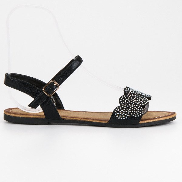 Comer Litteät sandaalit, jotka kiinnitetään soljella musta