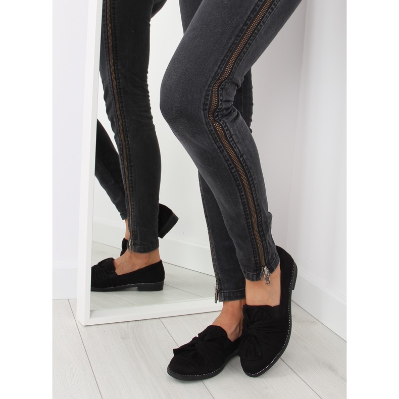 Mustat naisten housut, joissa musta rusetti 2