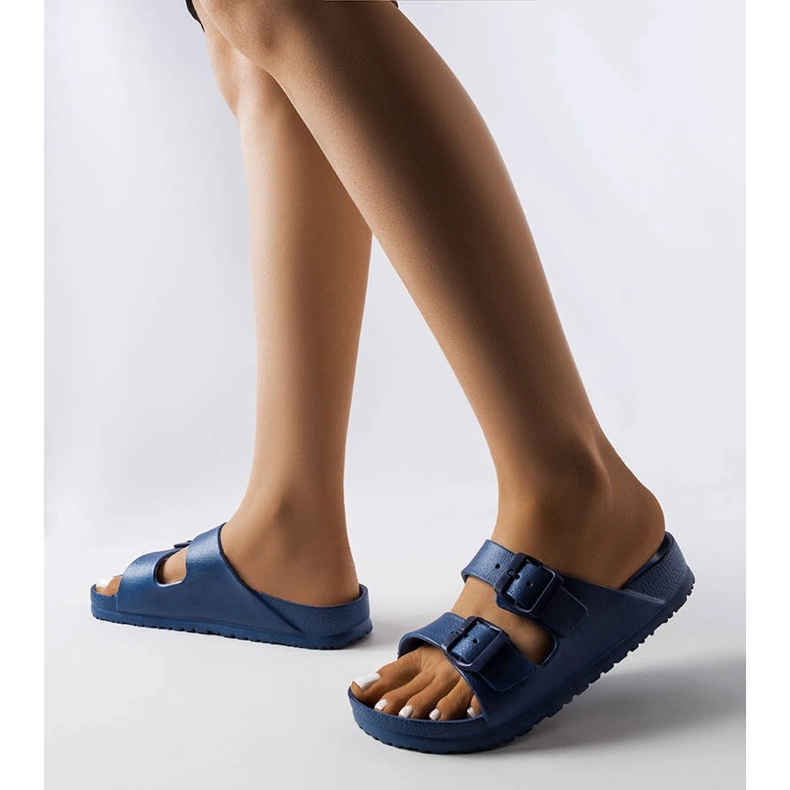 Tummansiniset kumiset liukumäet, joissa Eugene-soljet sininen 1