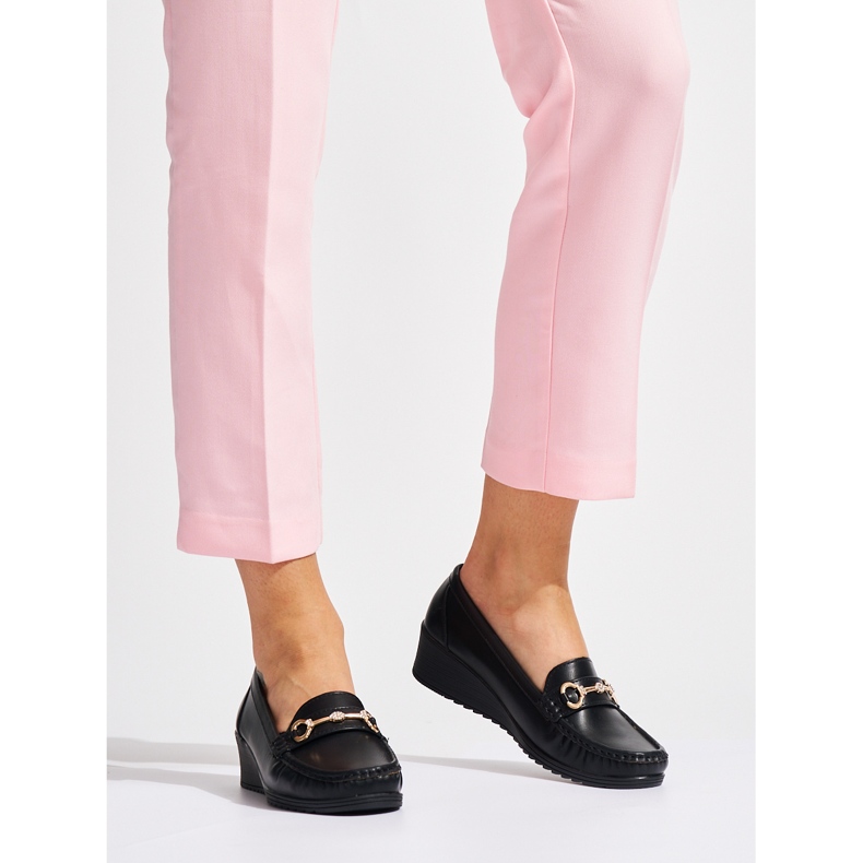 Mustat naisten kiilahousut kultakoristeilla 1