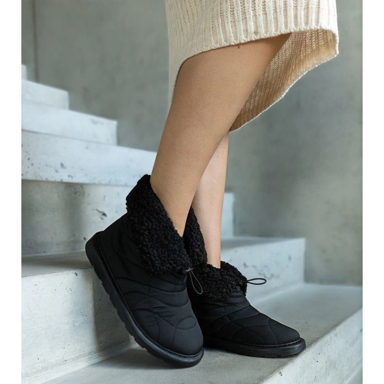 Mustat eristetyt lumisaappaat Caellita-mansetilla 2