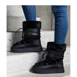 Mustat eristetyt nauhalliset lumisaappaat, joissa on turkki 1