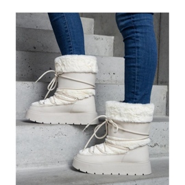 Istiss - Solean vaalean beige-eristeiset nauhalliset lumisaappaat, jotka on koristeltu turkilla 1