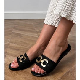 Mustat flip flops, jossa on kultainen koriste baarissa 1