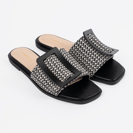 Goodin Tedeed -läpät litteällä mustavalkoisella pohjalla 2