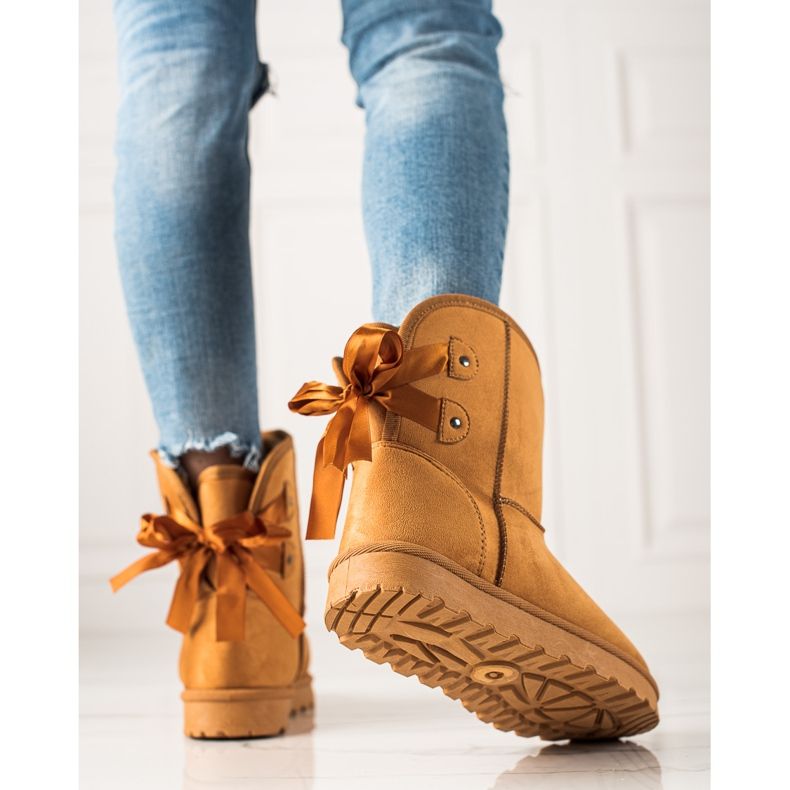 TRENDI Mukluki jousella keltainen 1