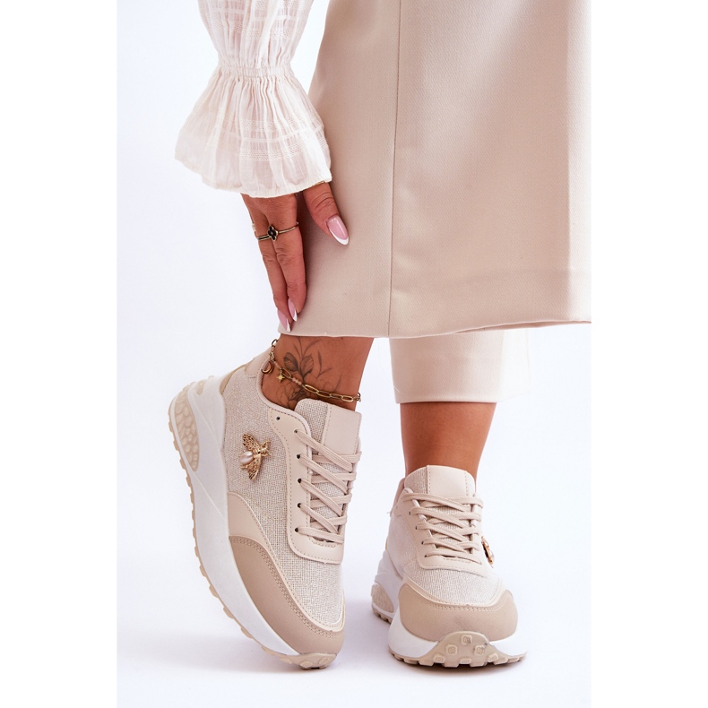 PS1 Kiiltävät urheilukengät beigellä Seneca-koristeella 1